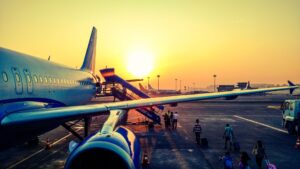 people getting onto a commercial plane