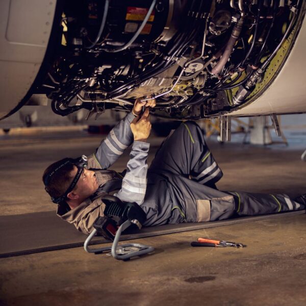 Person working under an airplane